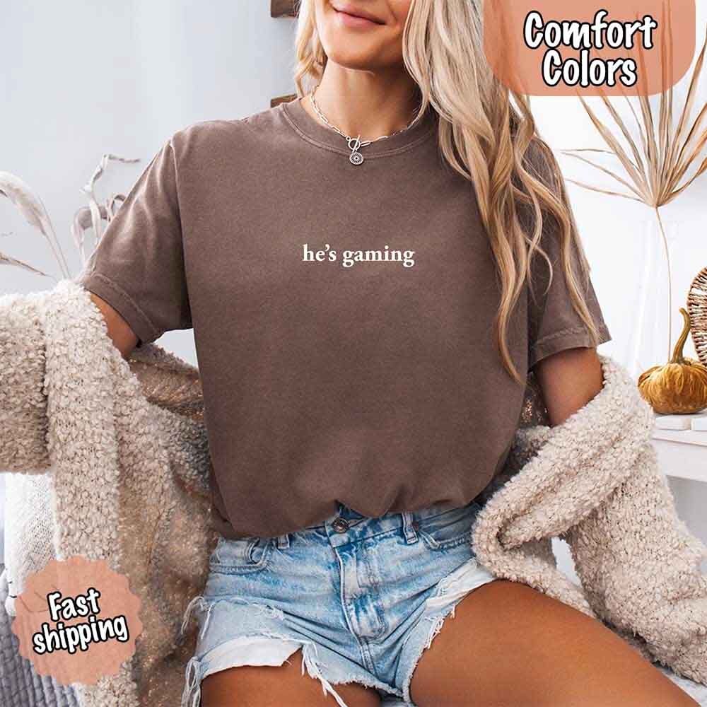 He’s Gaming – Funny Relationship Comfort Color Shirt for Her